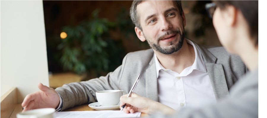 Man and woman meeting over coffee